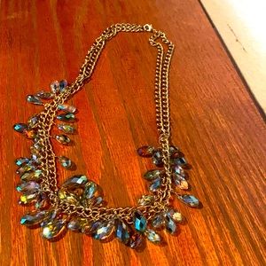 iridescent beaded necklace on a gold chain